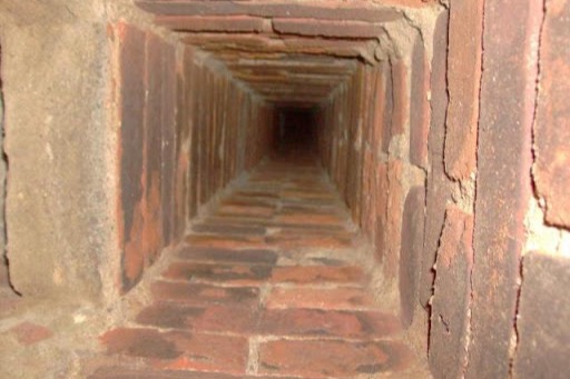 View up the inside of a brick chimney flue, chimney inspection offered in Charlotte, NC by the Smoke Alert team