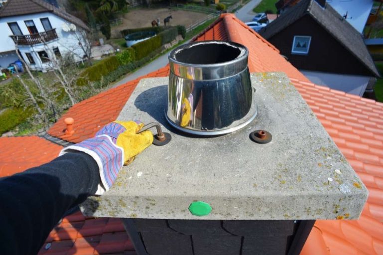 Stainless steel flue liner top set in a chimney crown, chimney relining for homes in Charlotte, NC by Smoke Alert